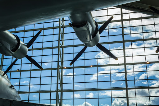 Airplane propellers against glass window sky